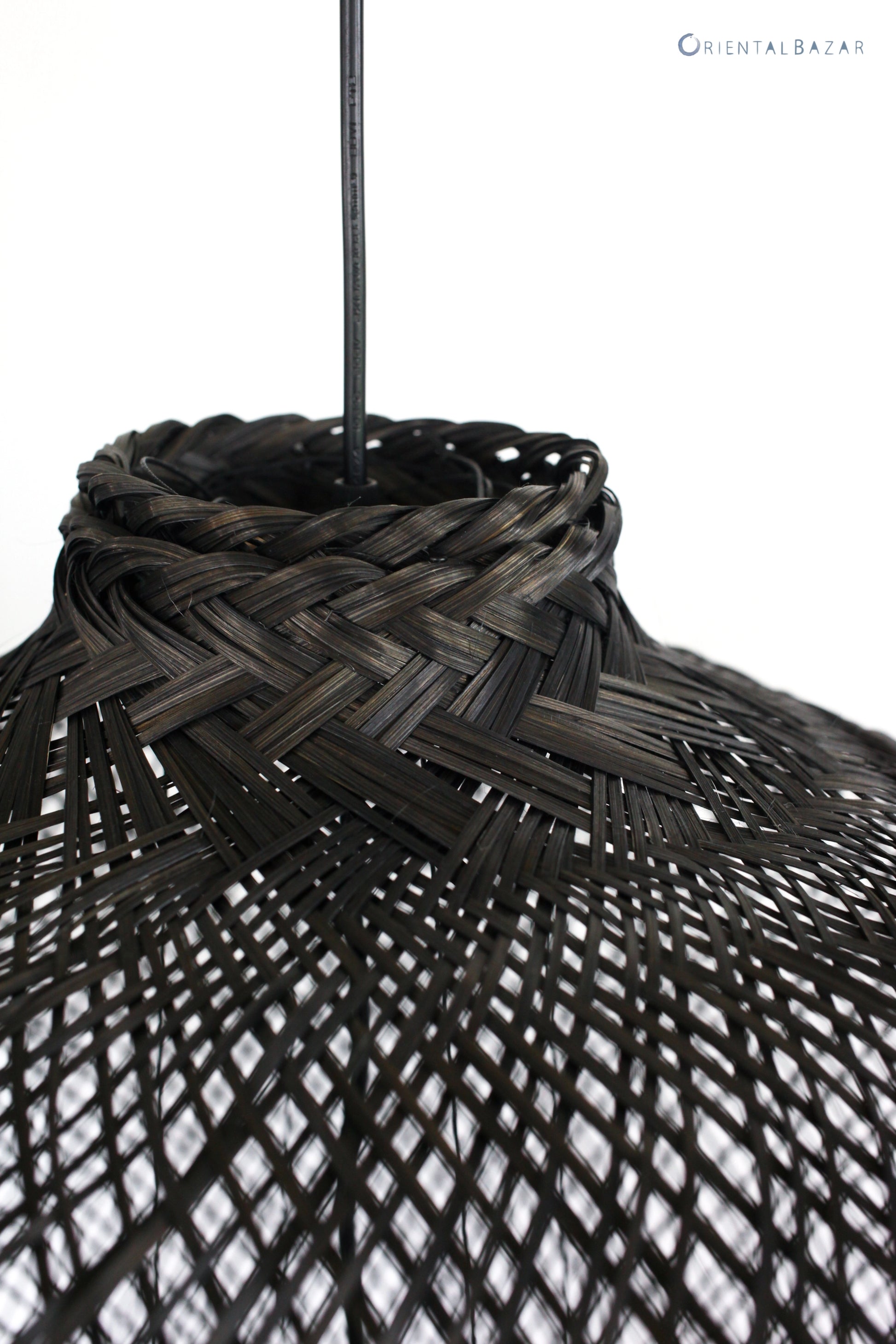 Close-up of top part of a black bamboo pendant light on a white background