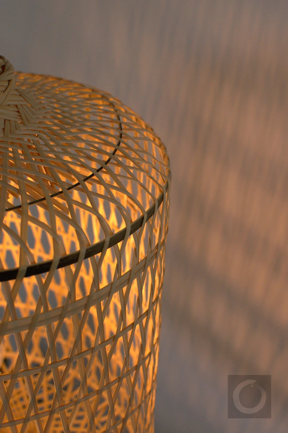Woven bamboo basket with a textured pattern on a blurred background