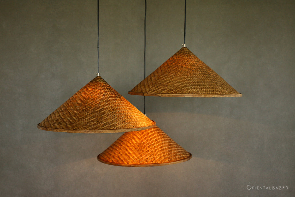 Three Asian hat shape woven Bamboo pendant lamps on a white background