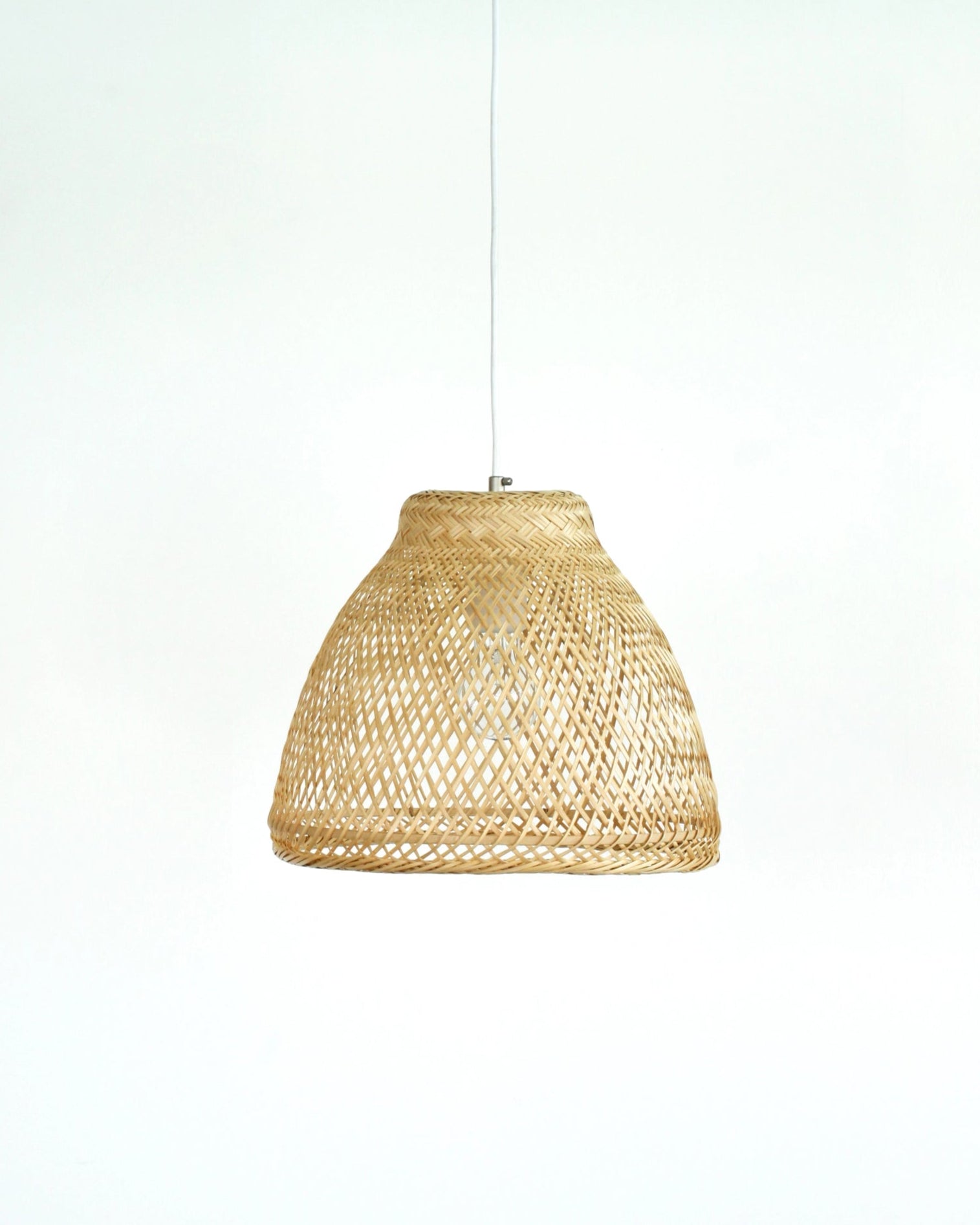 Wabi-sabi woven bamboo pendant light on a white background