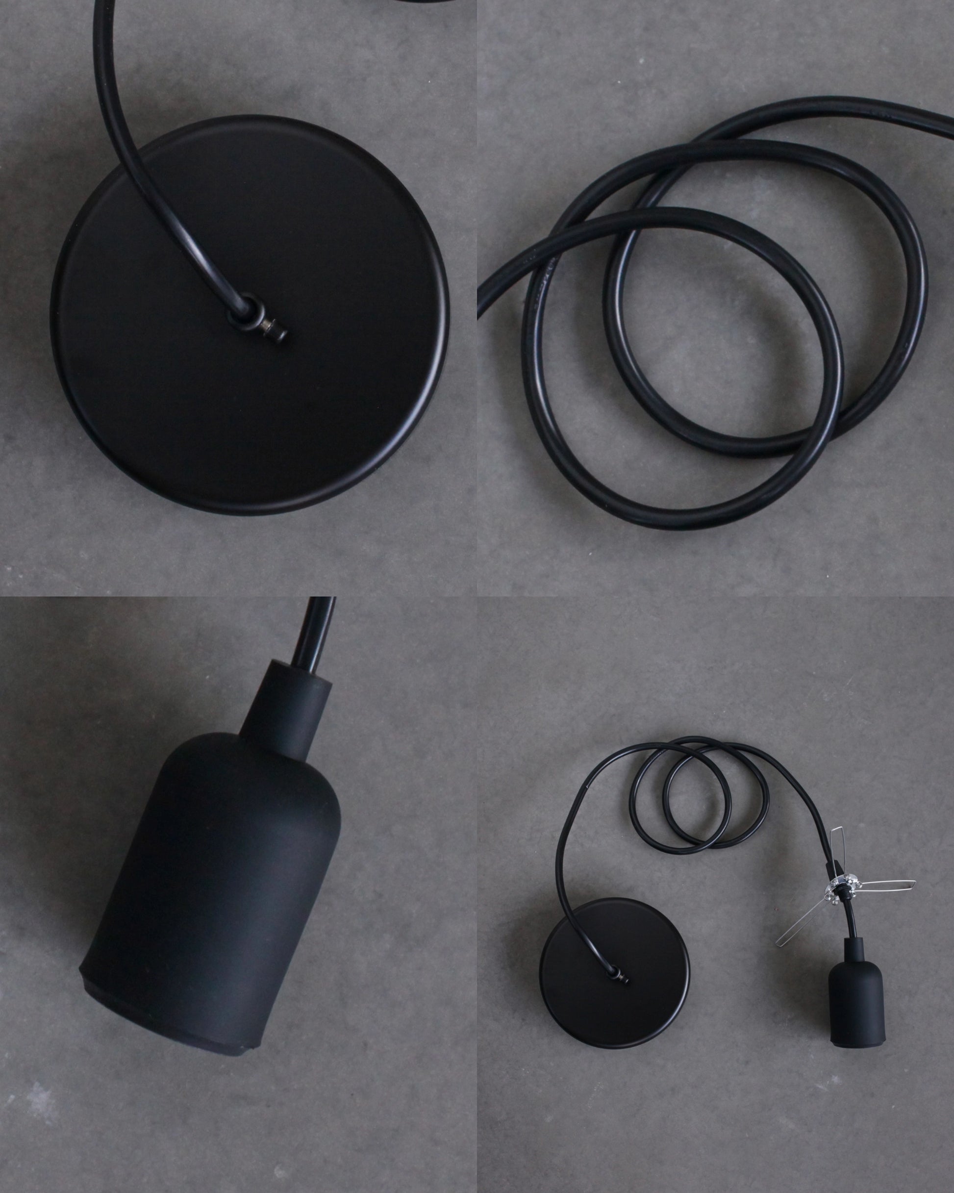 Black pendant light components on a gray surface