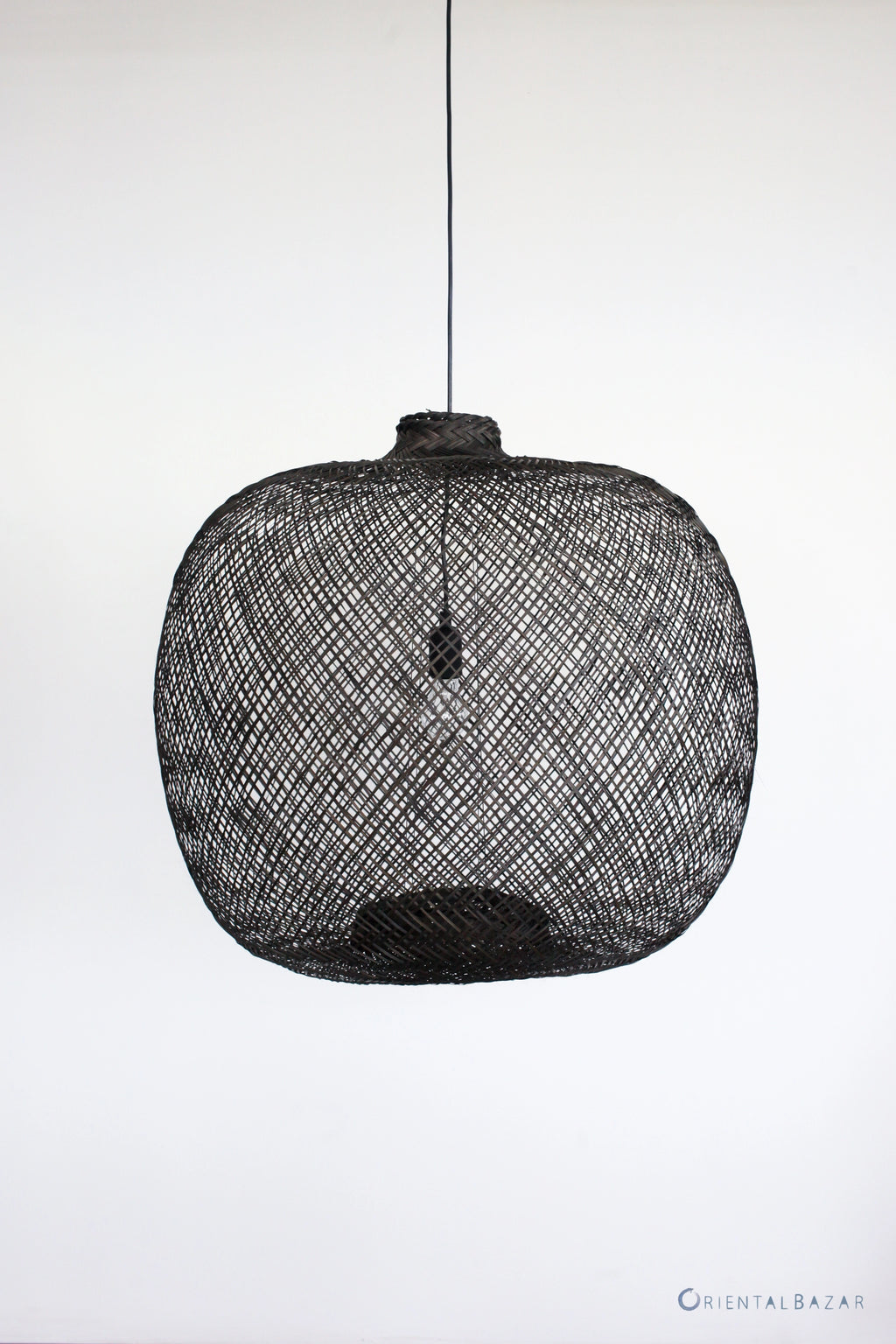 Black flexible round woven bamboo pendant light on a white background