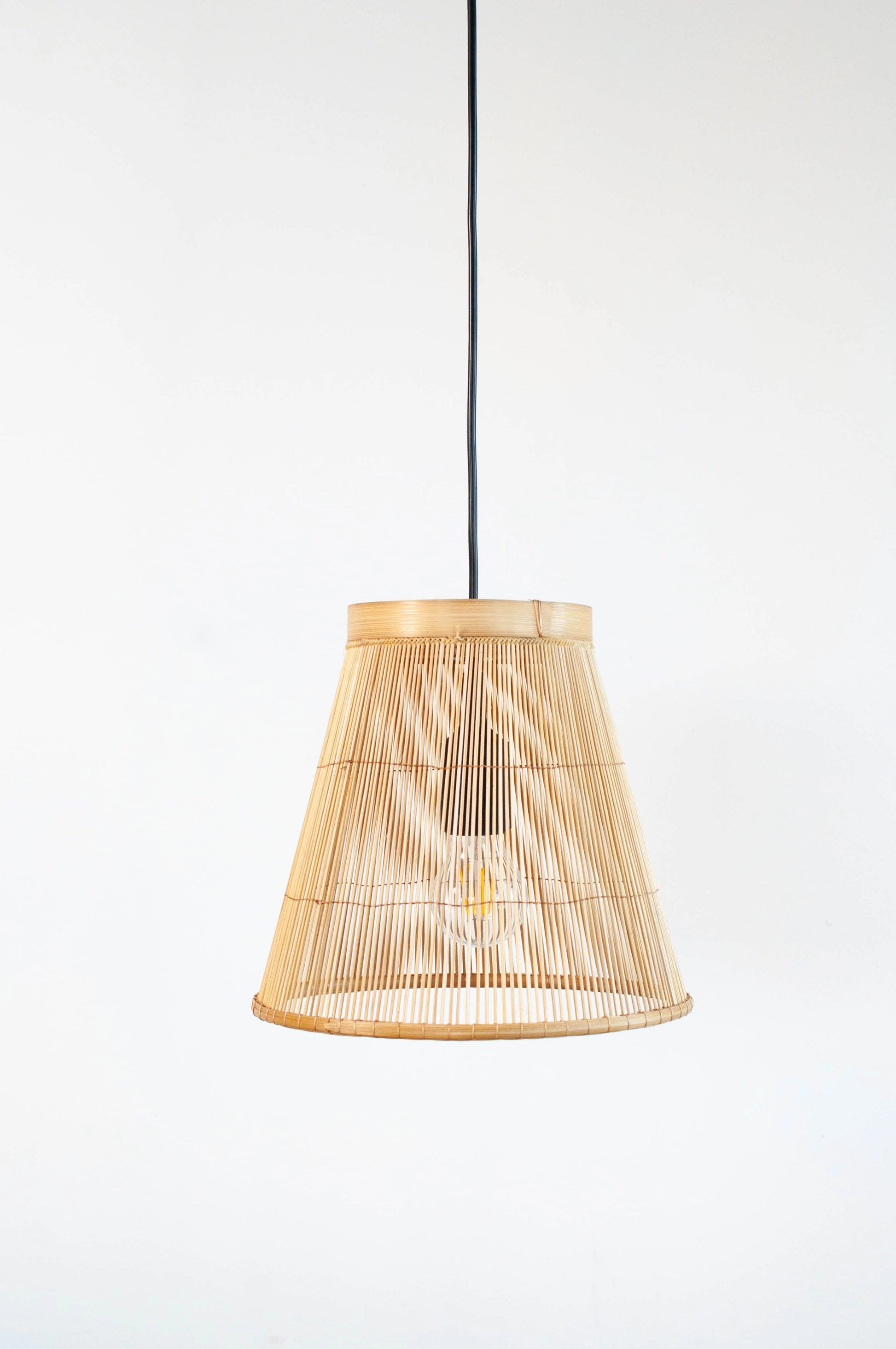 Minimalist bamboo pendant lamp with a white background