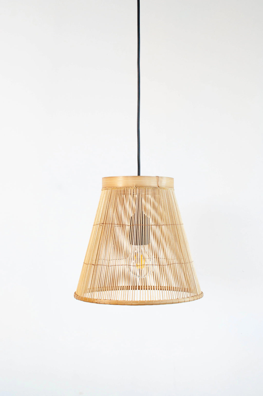 Minimalist bamboo pendant lamp with a white background