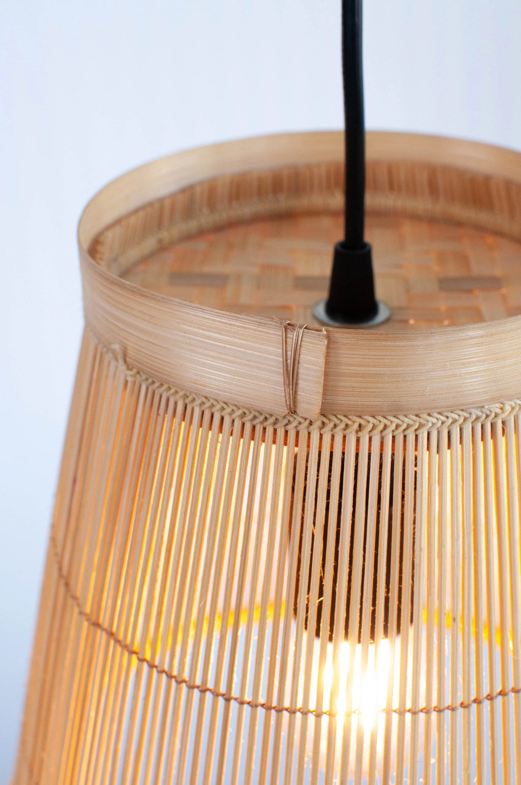 Close-up of a bamboo pendant light with a white background