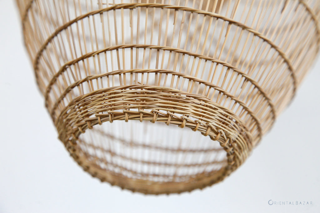 Close-up of a woven bamboo ceiling light fixture on a white background