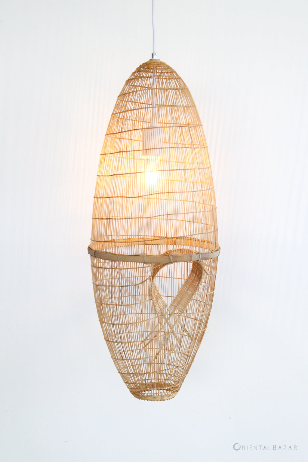 Woven bamboo and rattan fish-trap pendant light on a white background