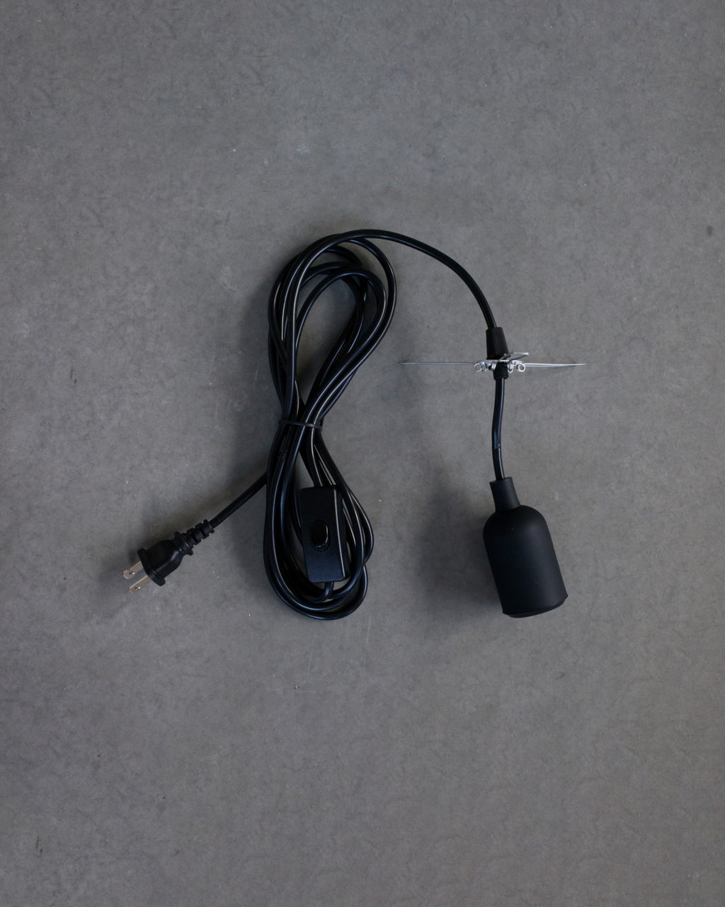Black plug-in lamp set on gray background