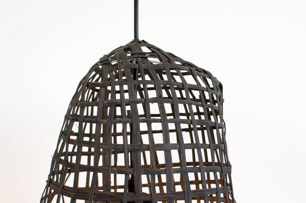 Woven dark charcoal bamboo pendant light on a white background