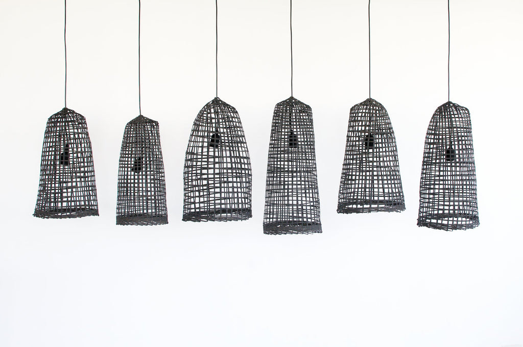 Set of six black wabi-sabi bamboo pendant lights on a white background