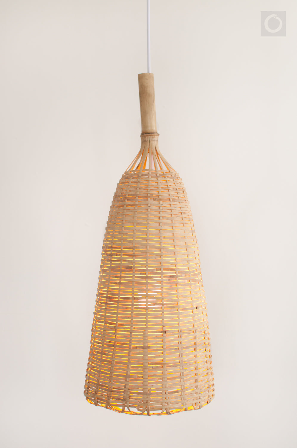 Bohemian woven bamboo pendant light on a plain background