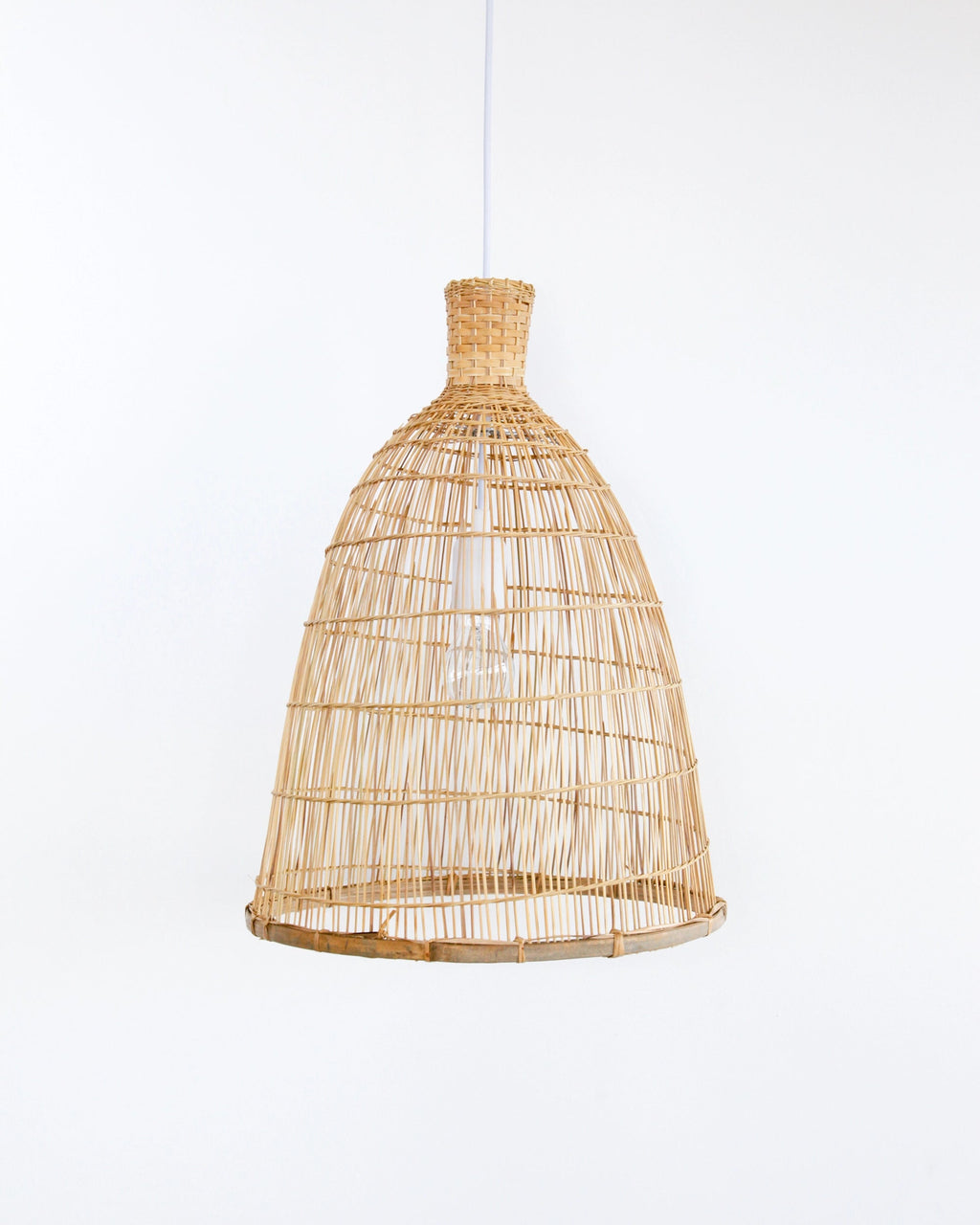Woven bamboo and rattan pendant light on a white background
